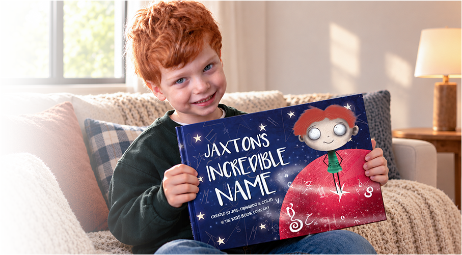 A child holding their personalised book, My Incredible Name